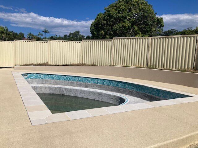 Resurfaced concrete pool surround on the Gold Coast